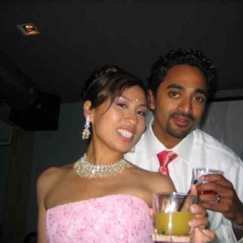 Chamath Palihapitiya and his ex-wife Brigette Lau pose a picture at a party.